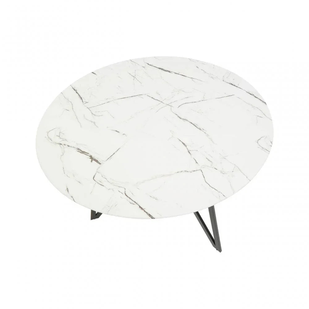 Round marble coffee table with white top and metal legs, overhead view