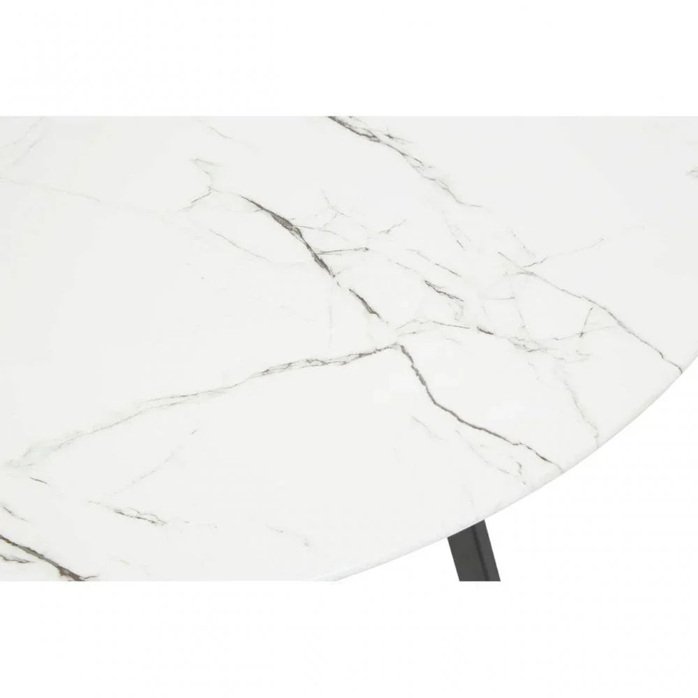 White marble dining table top with black veining and angled metal leg