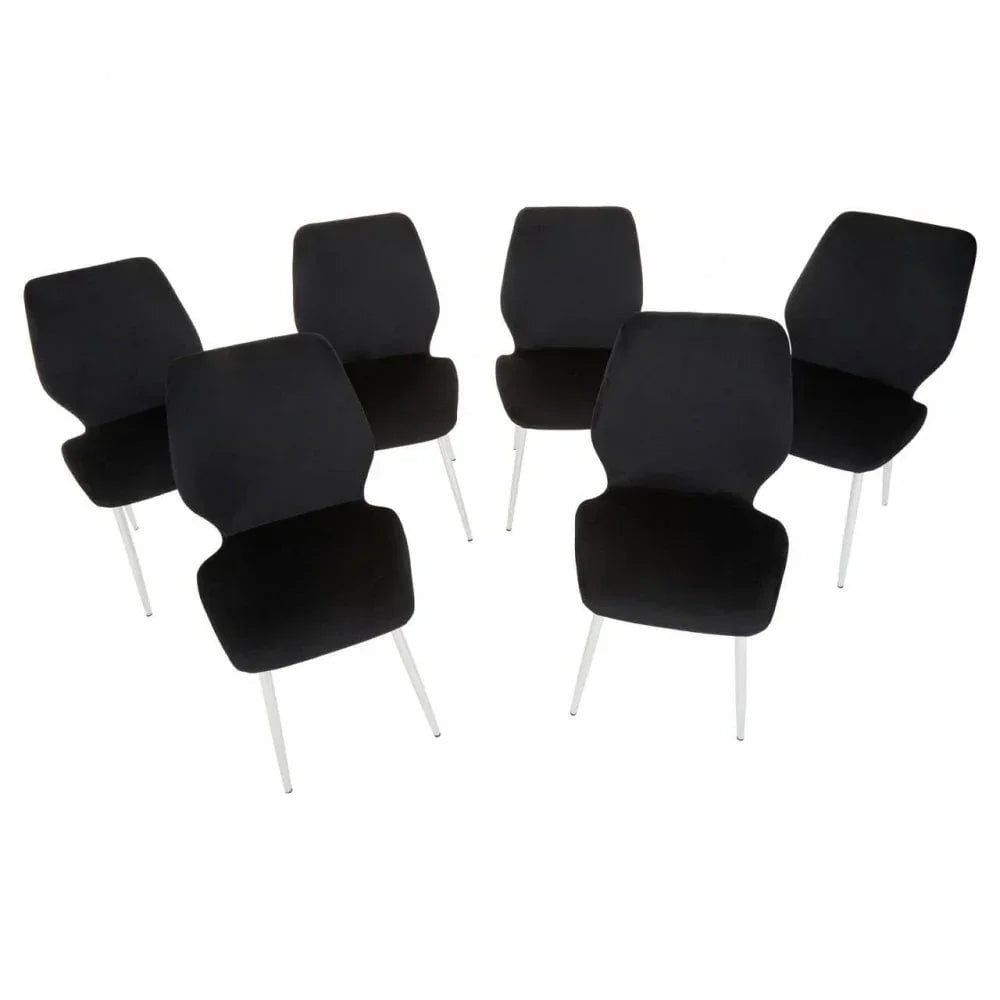 Set of five black dining chairs with metal legs arranged on white background