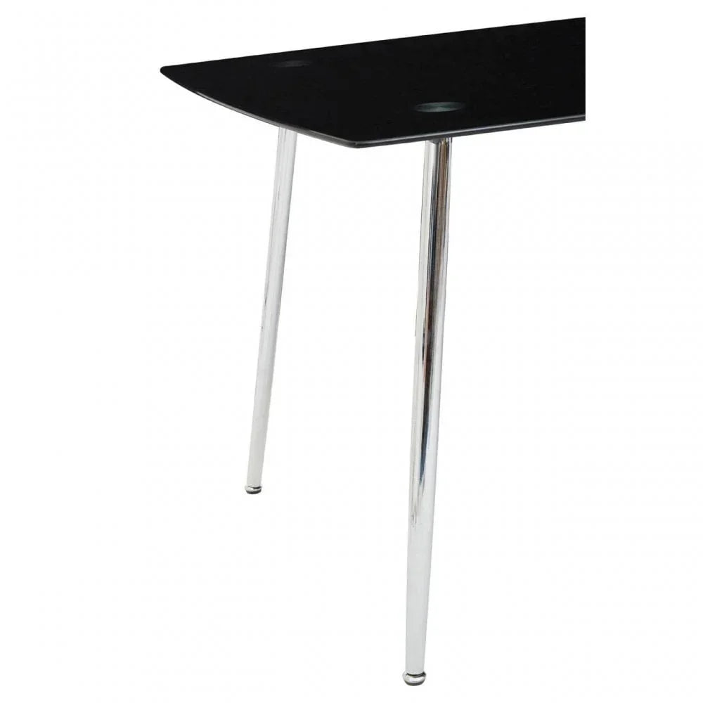 Black glass dining table corner with chrome metal legs, modern minimalist design