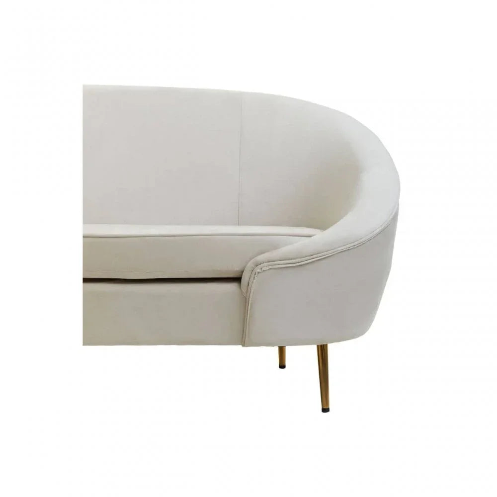 Cream fabric sofa with curved backrest and gold metal legs, close-up of arm and seat