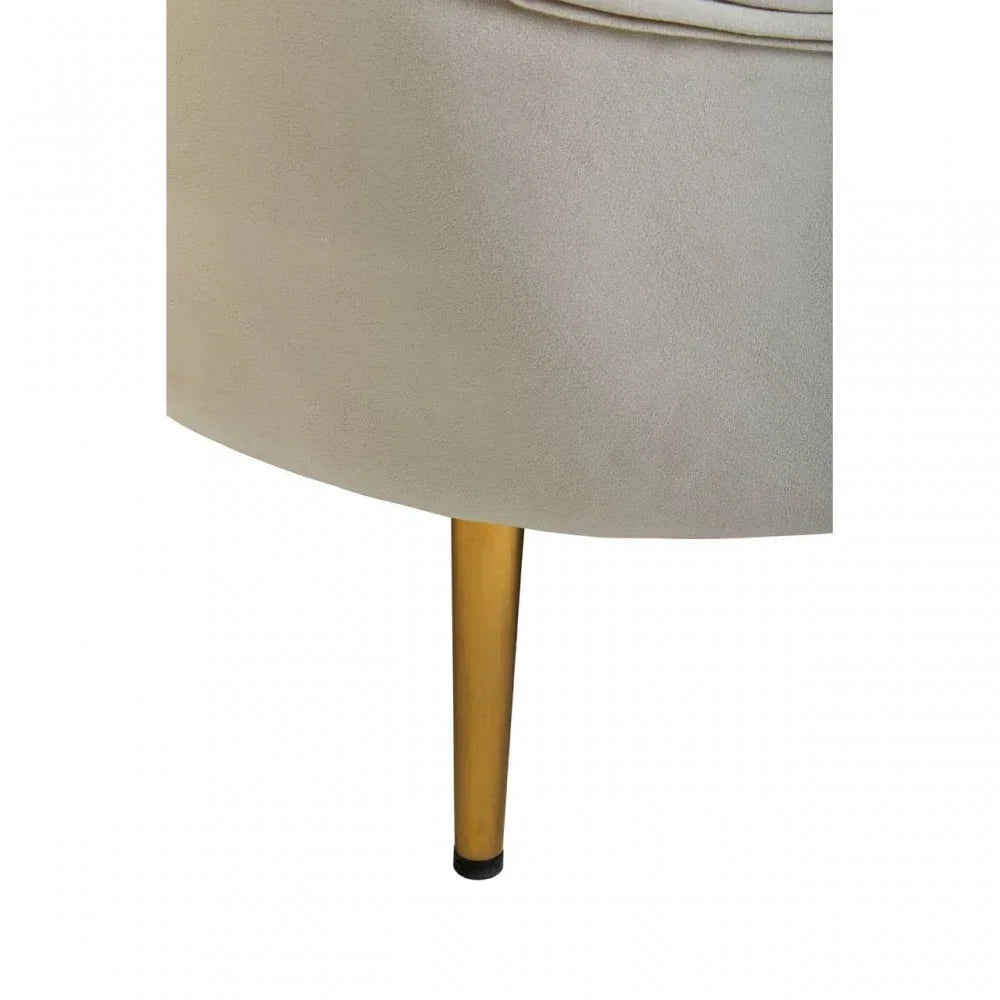Beige fabric chair with gold metal leg close-up