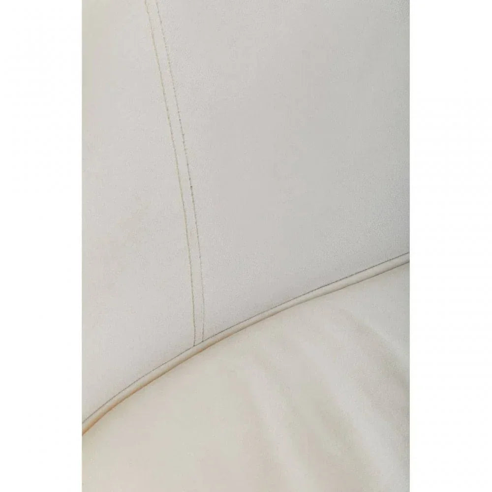 Close-up of cream sofa upholstery with visible stitching and smooth fabric texture