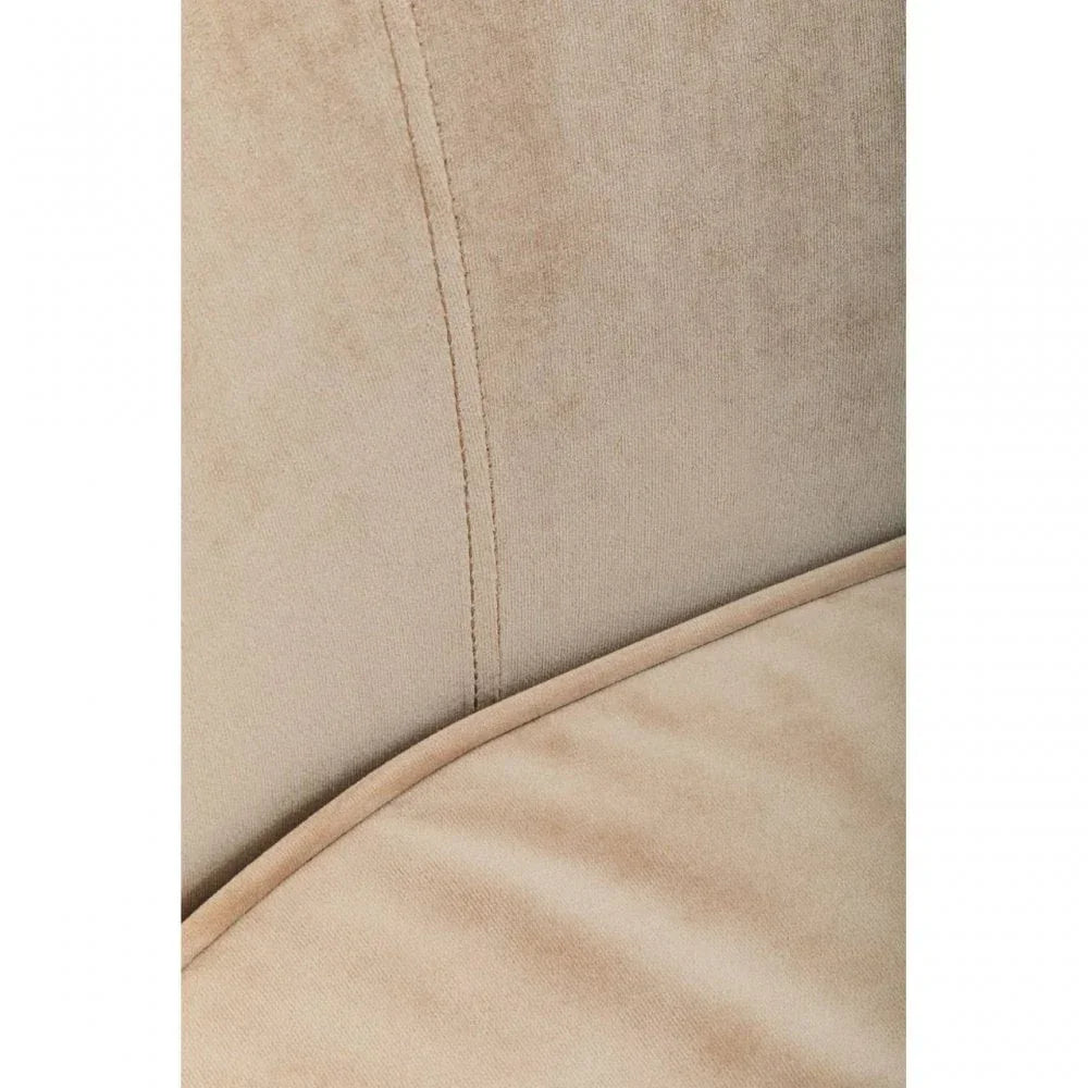 Beige upholstered sofa closeup showing soft fabric texture and seam detailing