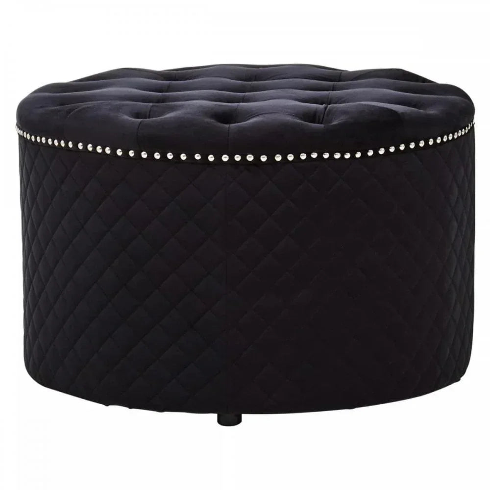 Black velvet ottoman with diamond quilting, button-tufted top and silver nailhead trim