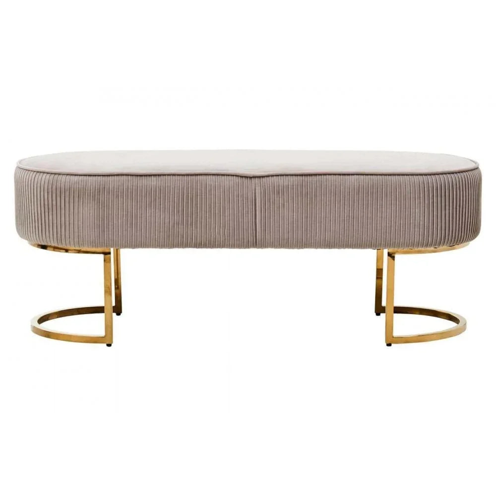 Beige upholstered bench with vertical ribbed fabric and gold metal legs, front view