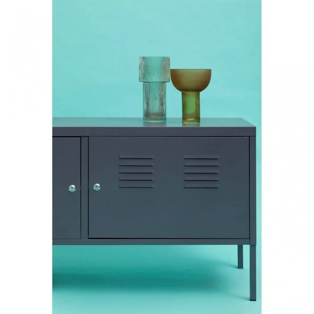 Dark grey metal storage cabinet with louvered doors and glass vases on top