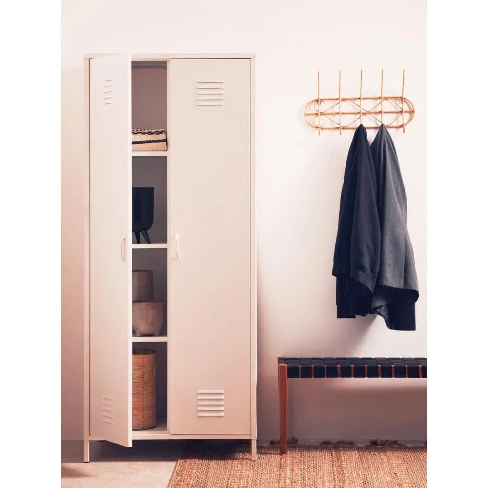 White metal storage cabinet with open door beside bench and wall-mounted coat rack