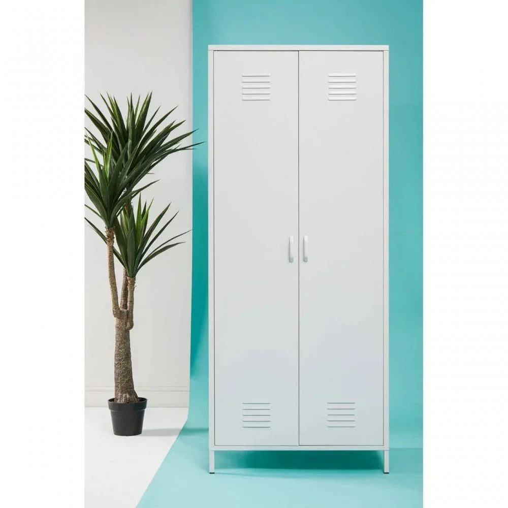 White metal storage cabinet with double doors and handles, styled beside a tall indoor plant