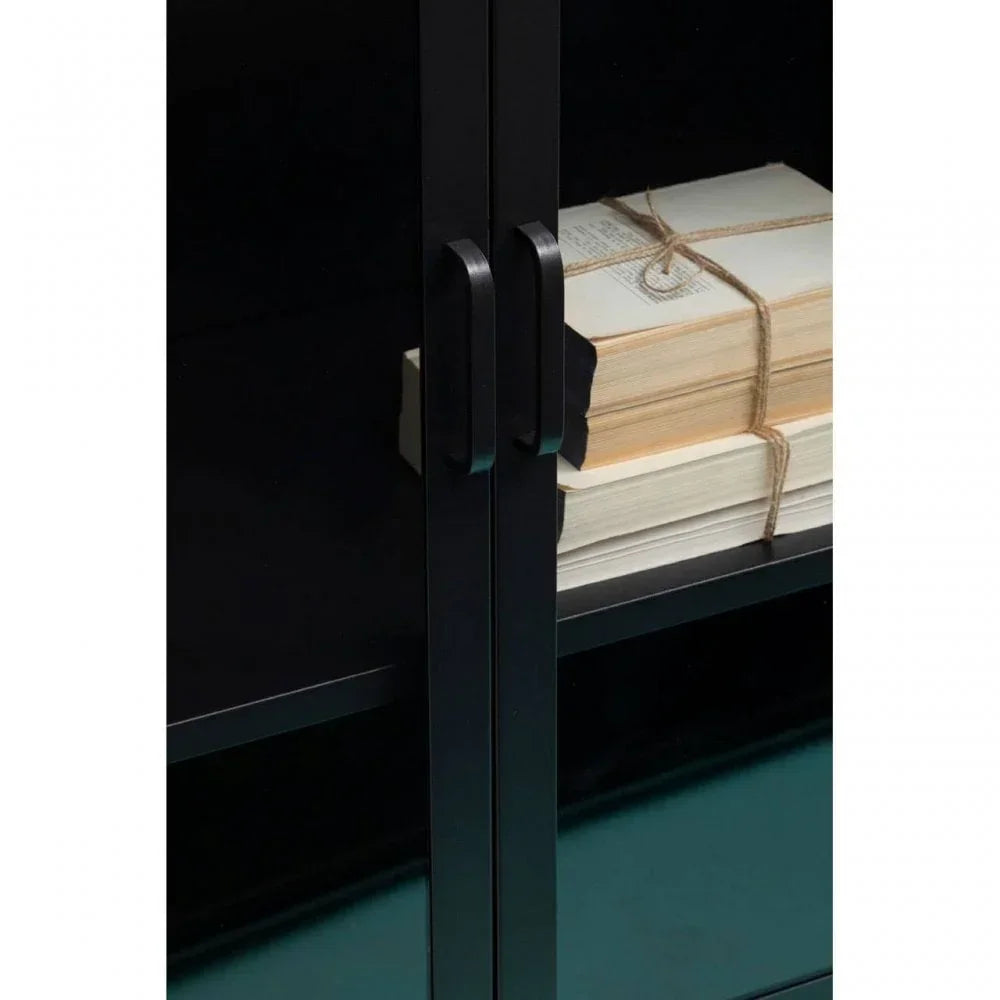 Black cabinet door handles and shelf with stack of books tied in twine