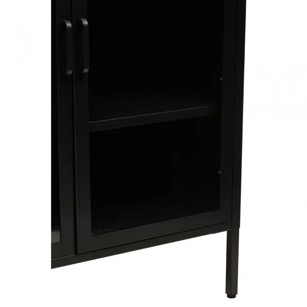 Black metal cabinet with glass doors and shelf, close-up showing handle and frame detail