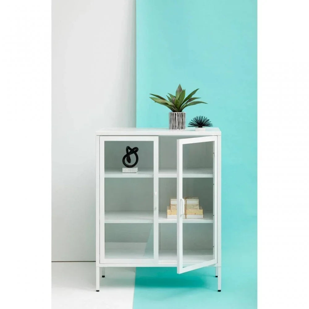 White glass display cabinet with open door, shelves holding decor and storage boxes