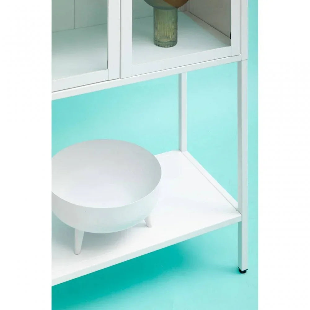 White metal shelving unit with a decorative bowl on lower shelf against blue background