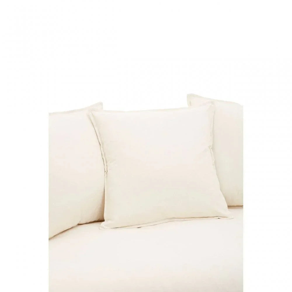 Cream sofa with matching square back cushions in close-up view