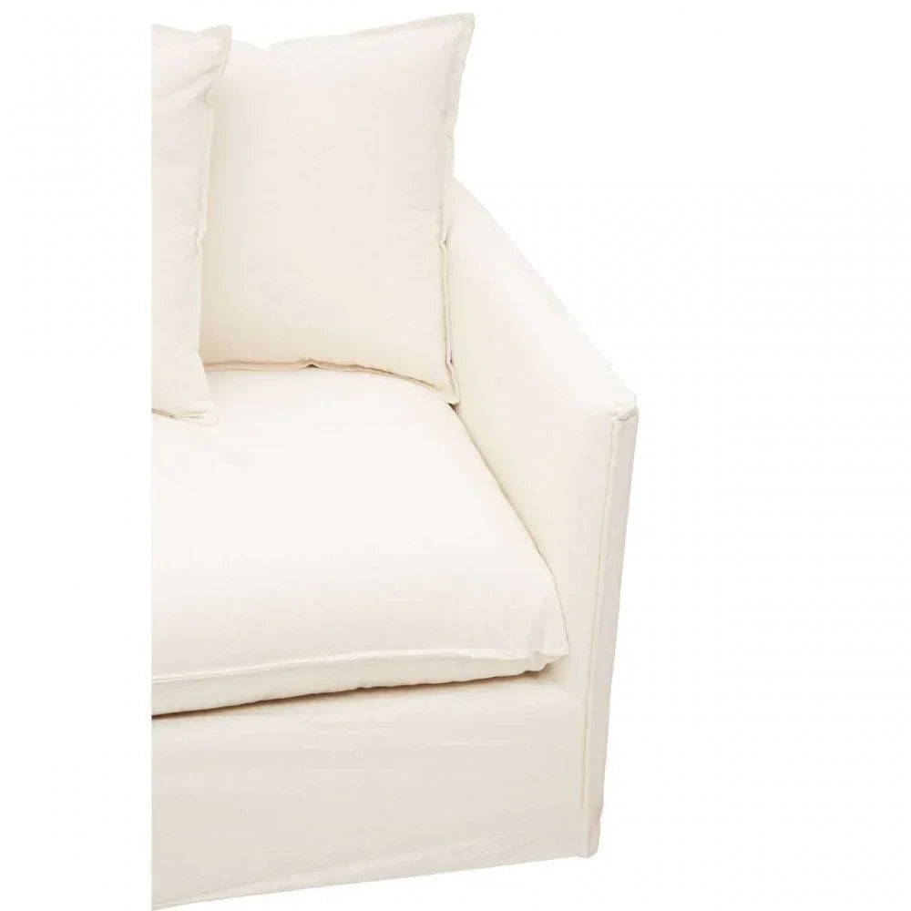 Cream fabric sofa corner with thick seat cushion and matching back pillows