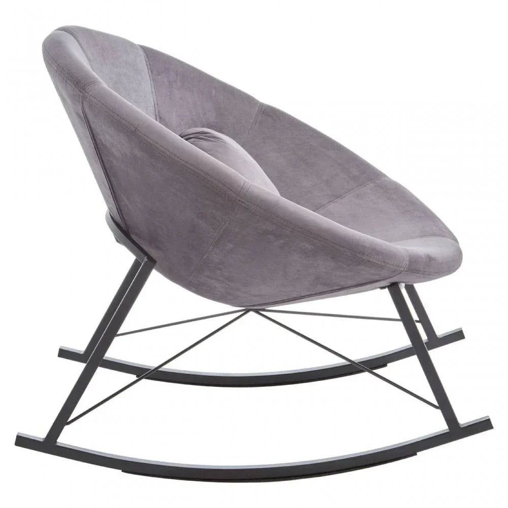 Grey velvet rocking chair with metal frame and round seat, side angle view