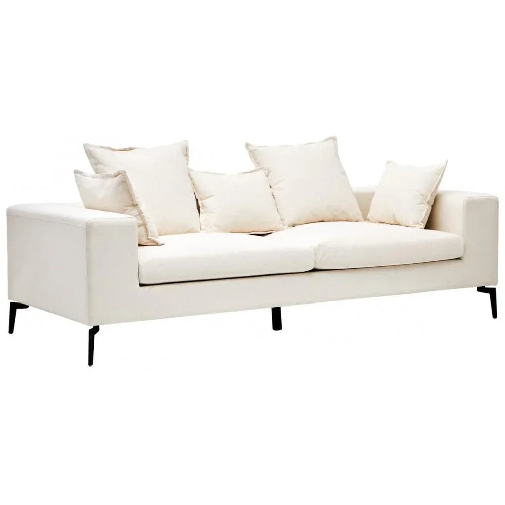 Cream fabric sofa with black metal legs and five matching cushions
