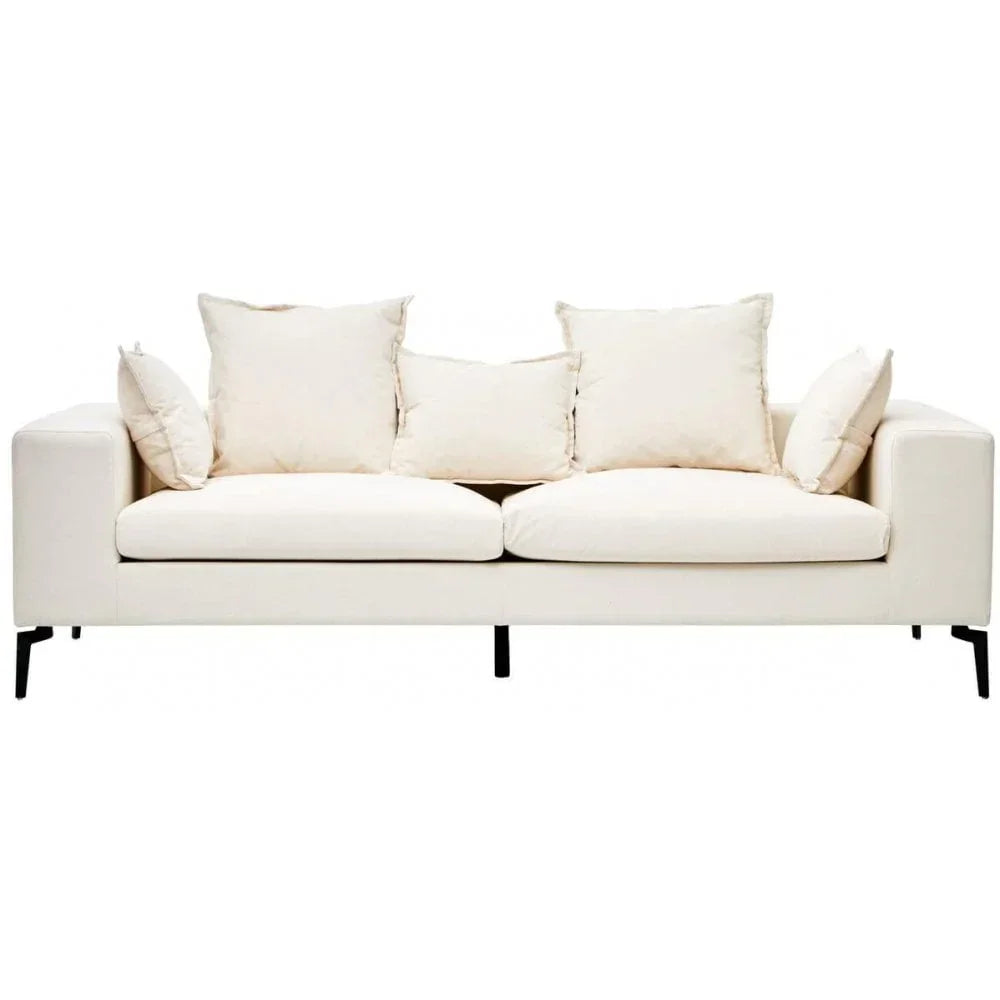 Cream fabric sofa with loose back cushions and slim black metal legs, front view