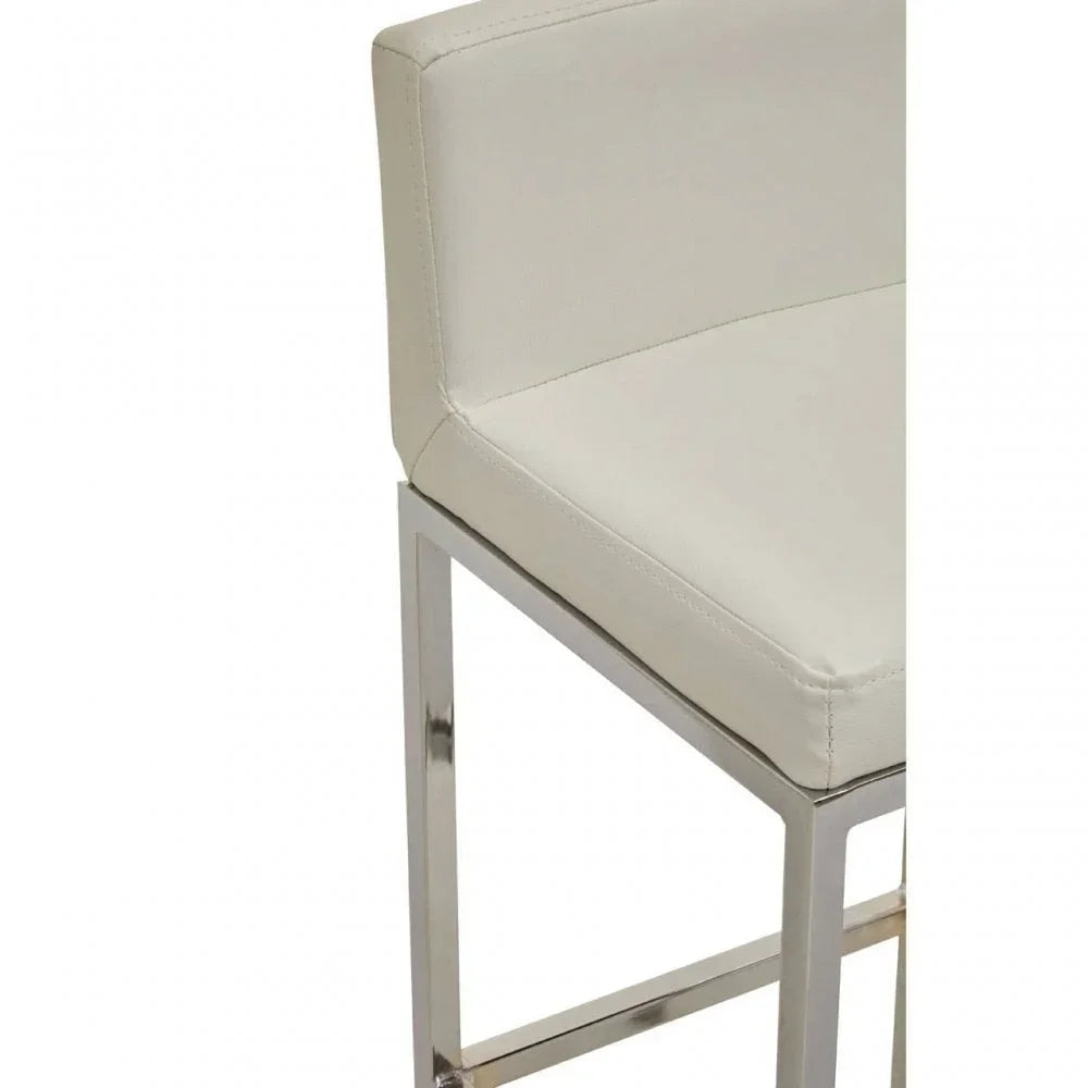 Cream bar stool with chrome legs and low backrest, close-up of seat and frame