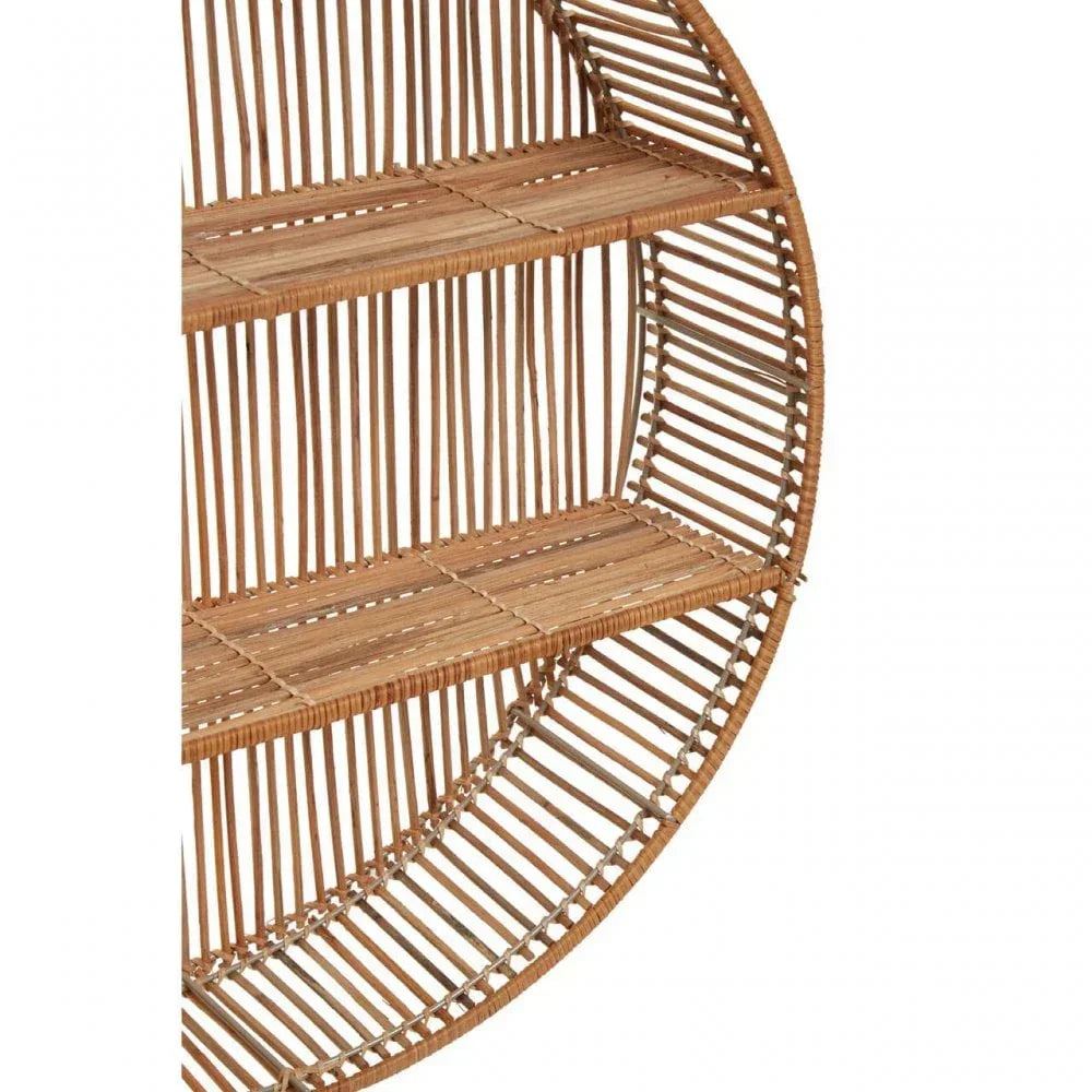 Round rattan wall shelf with two wooden shelves and open slat design, side angle view