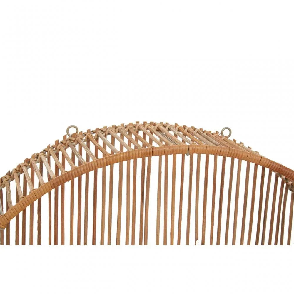 Close up of natural rattan furniture backrest with curved slats and hanging rings
