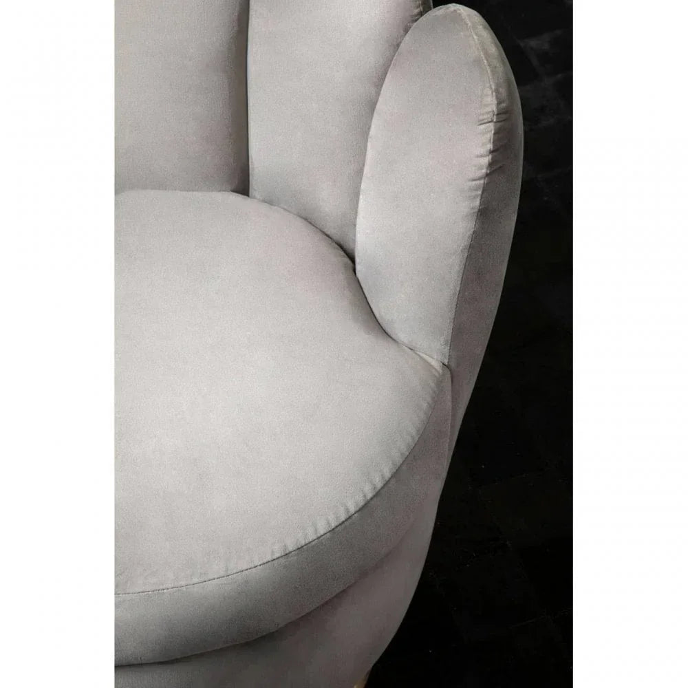 Close-up of grey fabric armchair seat and armrest with curved cushion design