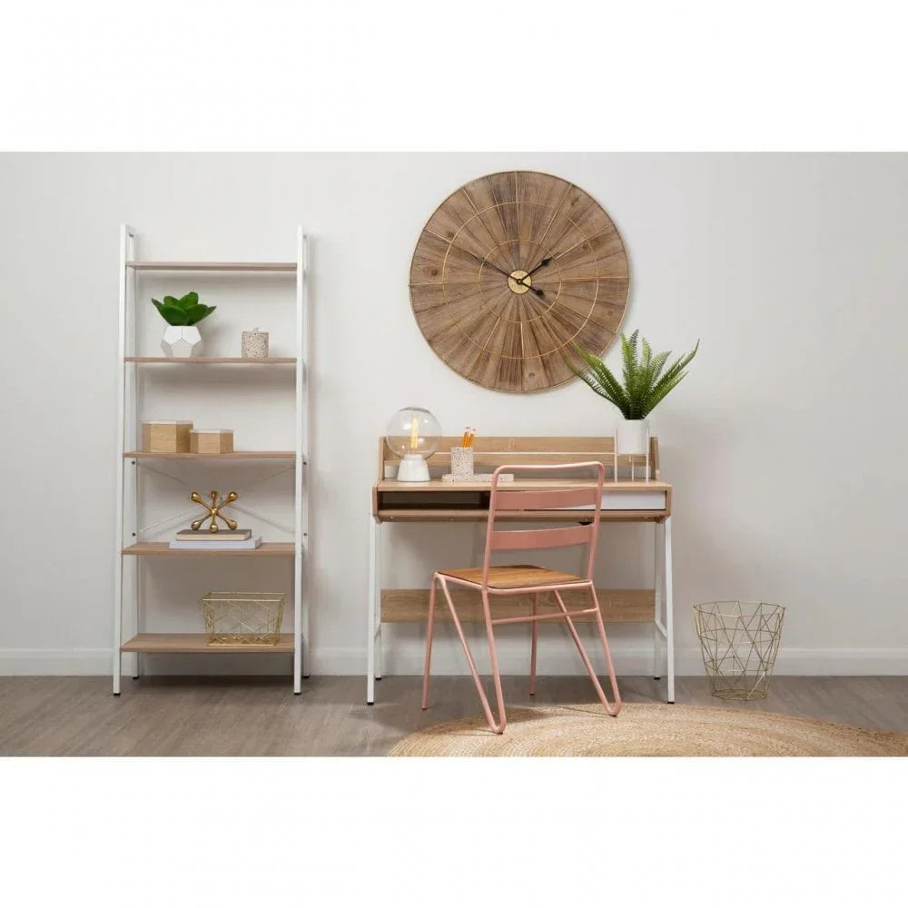 Wood and white metal desk with shelving unit, pink chair, large wall clock, home office