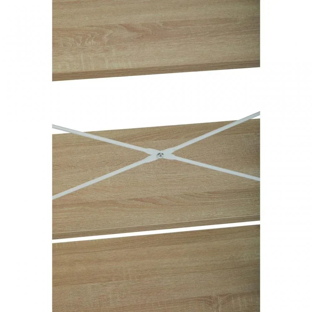 Oak effect wood shelf with white metal cross support detail, close-up view