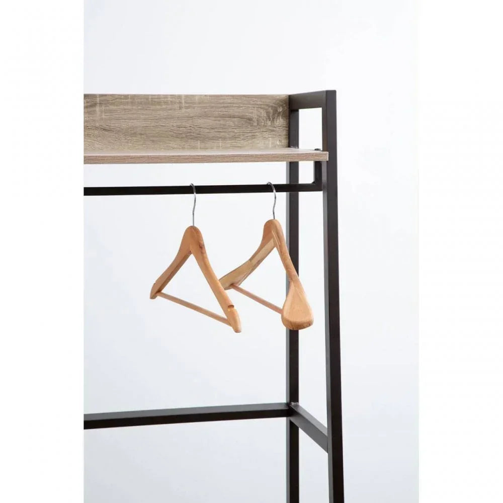 Metal and wood clothes rail with two wooden hangers against a white background
