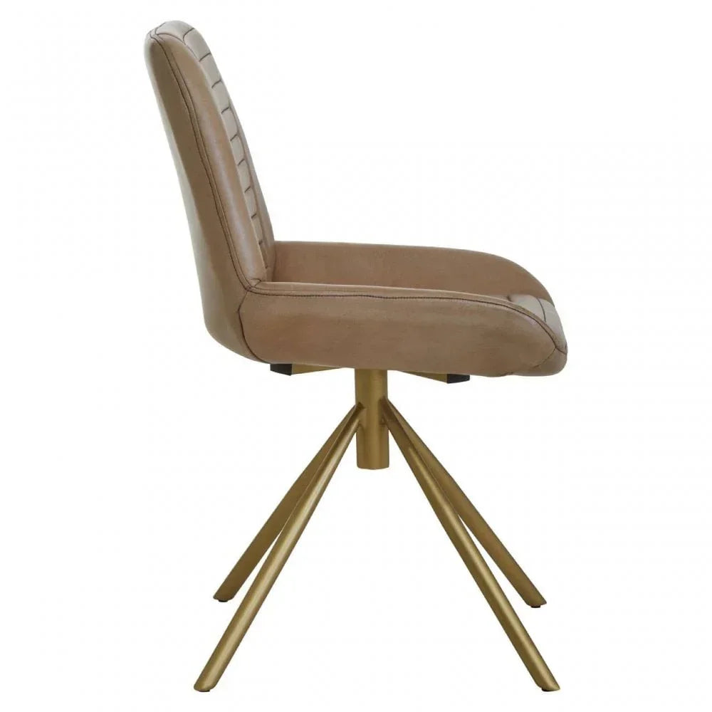 Tan upholstered dining chair with gold metal legs, side view
