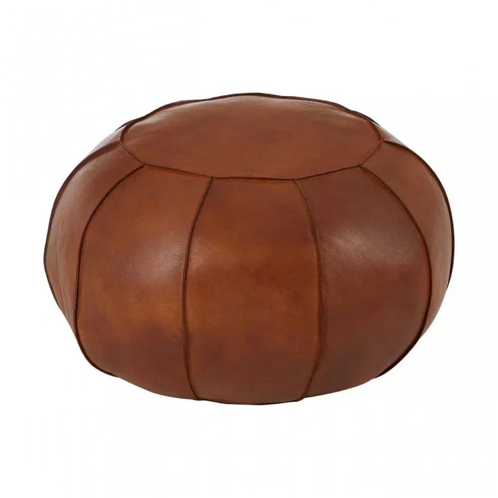 Brown leather pouffe ottoman with stitched panel design on white background