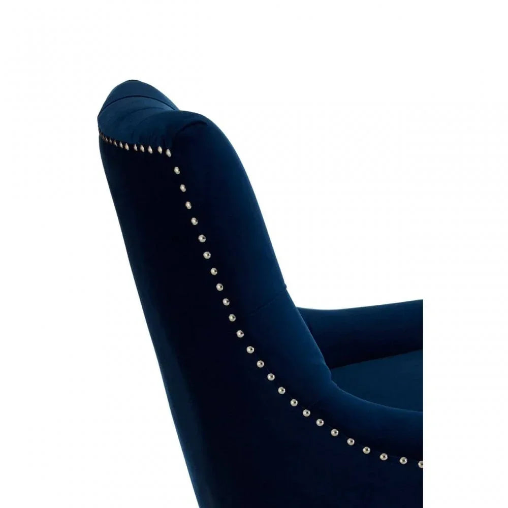 Navy velvet dining chair with silver stud detailing on backrest