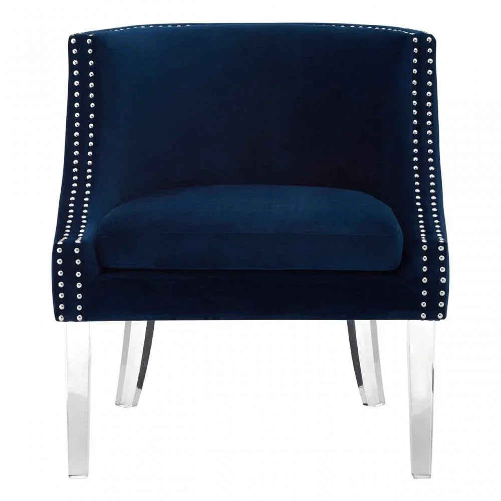 Navy velvet accent chair with silver stud trim and clear acrylic legs, front view