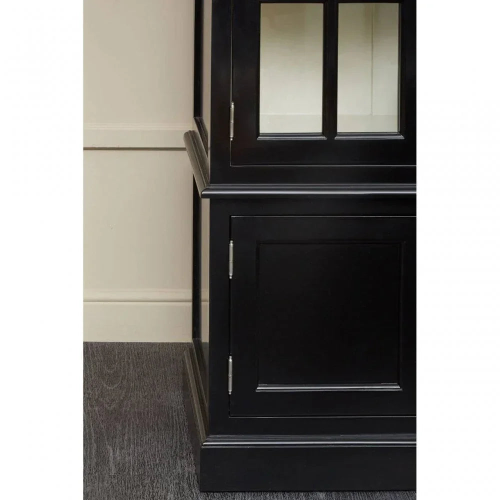 Black wooden display cabinet with glass doors and lower storage section, close side angle