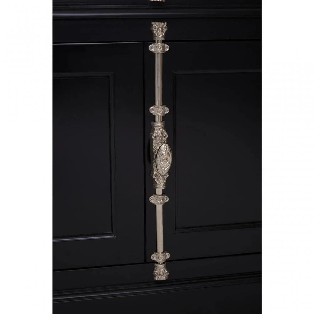 Black cabinet with ornate silver handle and decorative panel detailing