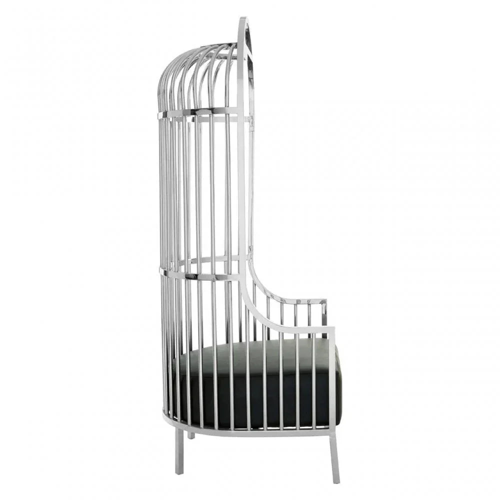 Modern silver metal accent chair with curved cage back and black seat cushion, side view