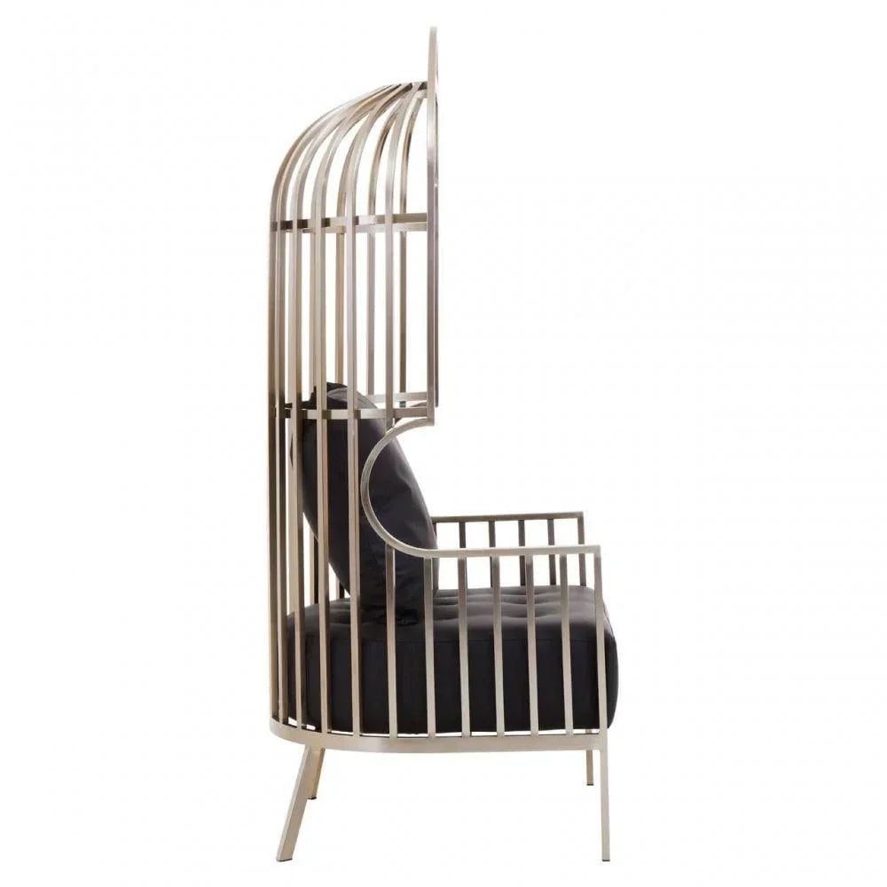 Side view metal cage accent chair with black seat and back cushions