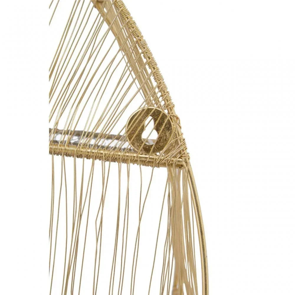 Closeup of gold metal wire shelf with keyhole bracket for wall mounting