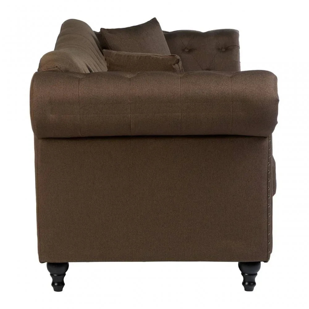 Side view of brown fabric sofa with rolled arm and black wooden legs