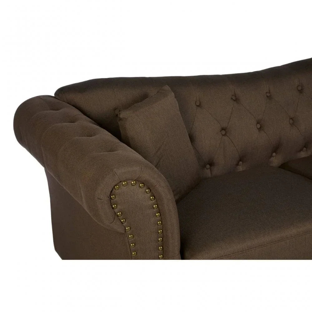 Brown fabric Chesterfield sofa arm with button tufting and brass stud detailing