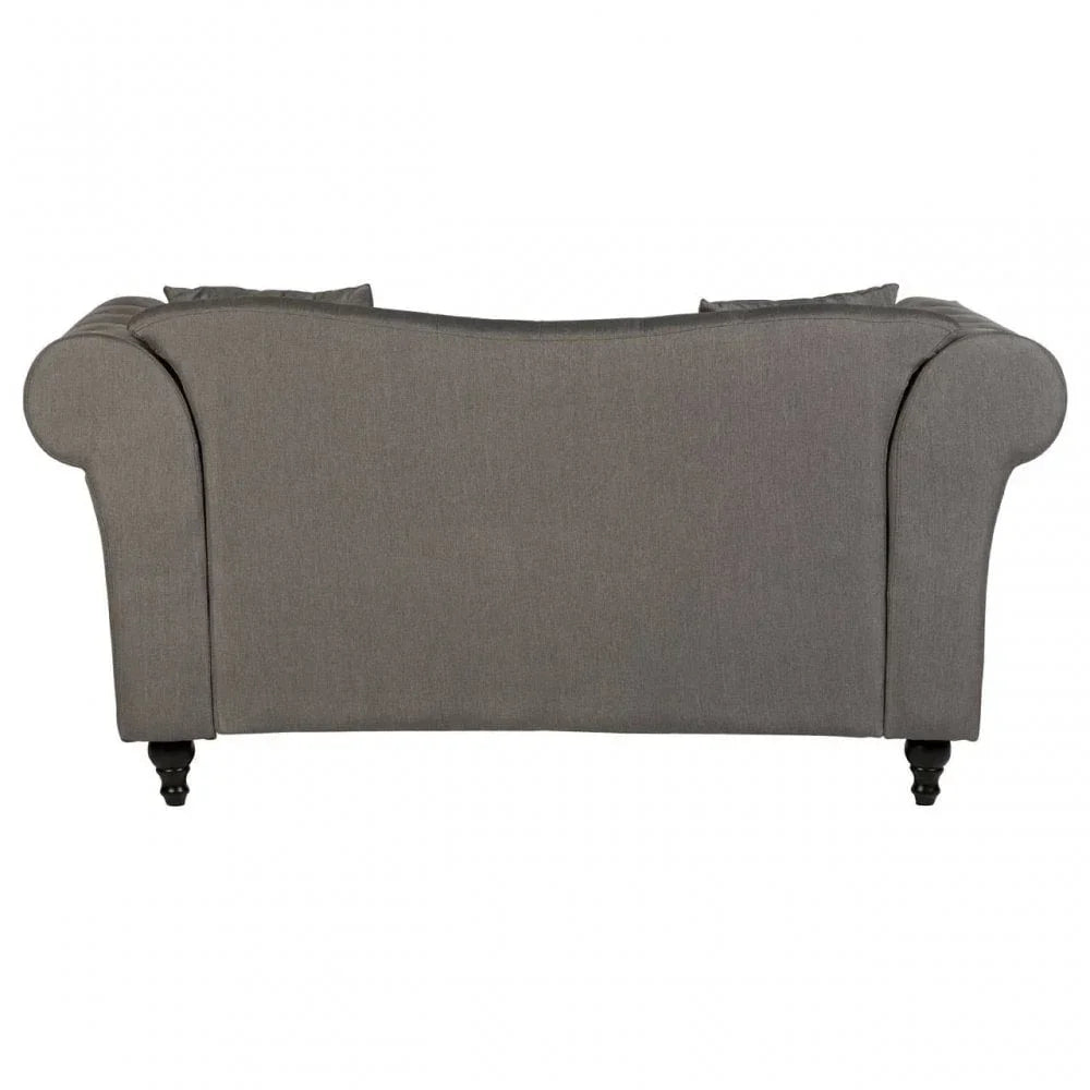 Back view of grey fabric sofa with rolled arms and wooden legs