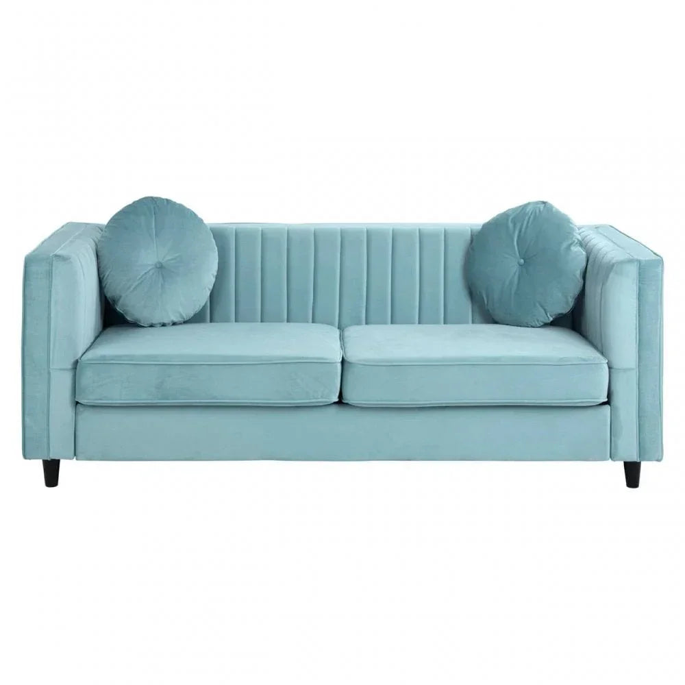 Light blue velvet sofa with vertical stitching and round cushions, front view