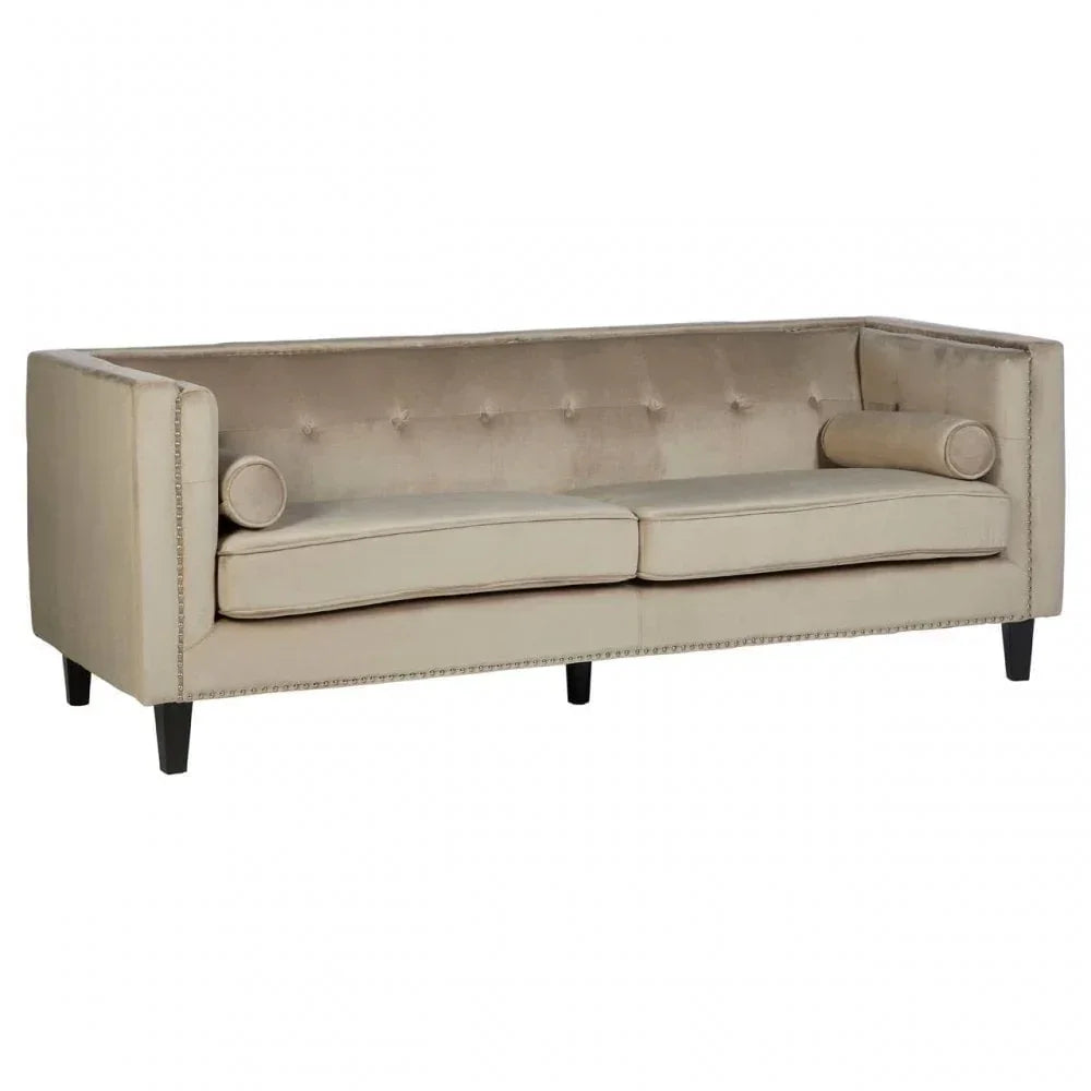 Beige velvet sofa with tufted back, square arms and cylindrical cushions, front view