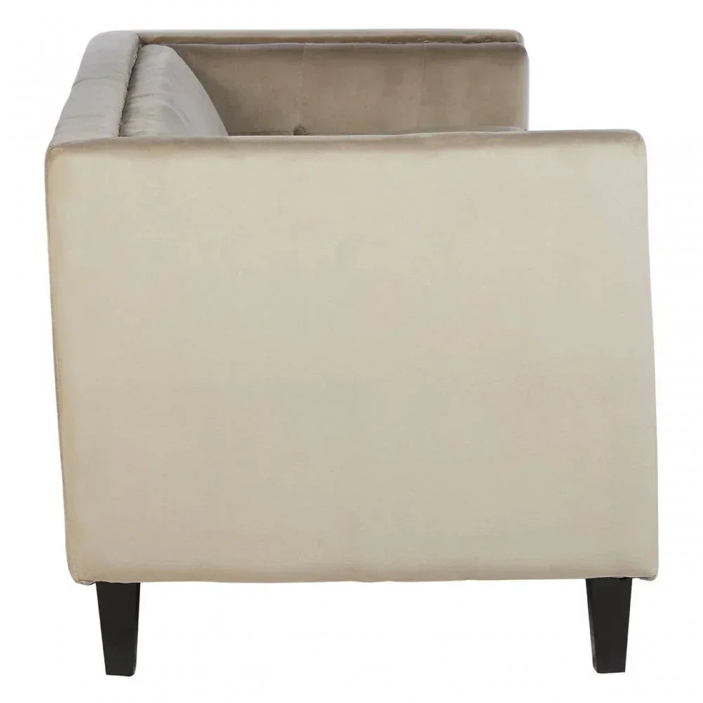 Side view of beige velvet sofa with tufted backrest and tapered black legs