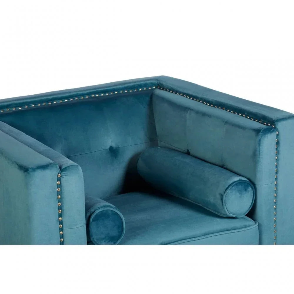 Teal velvet armchair with gold stud detailing and matching bolster cushion, corner view