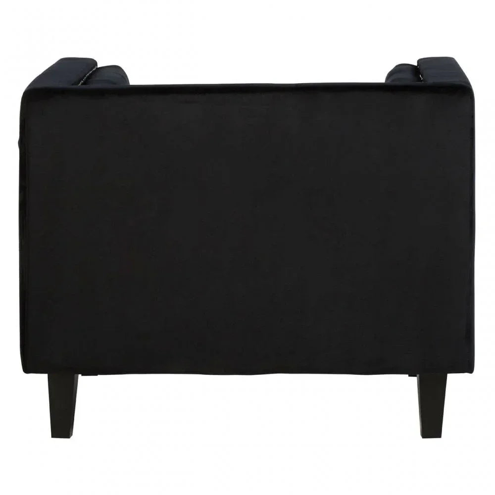 Back view of black velvet sofa with slim wooden legs