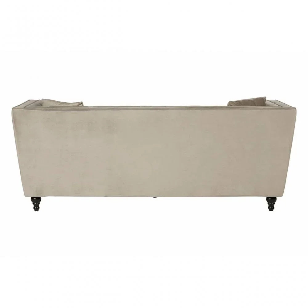 Back view of beige fabric sofa with turned wooden legs and scatter cushions