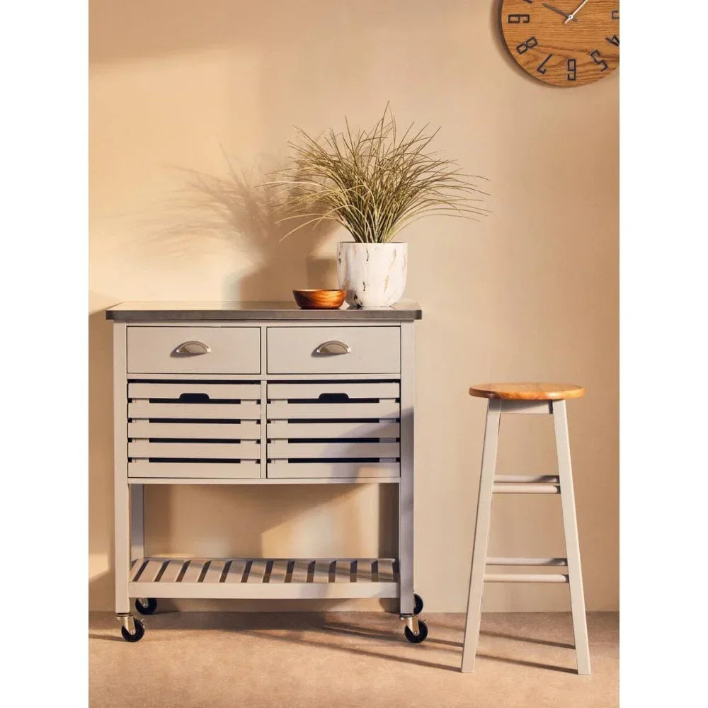 Grey kitchen trolley with drawers, open shelf, and wooden top next to matching bar stool