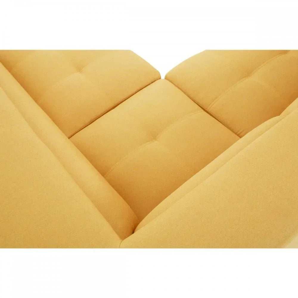 Close up of corner section yellow fabric sofa with tufted seat cushions