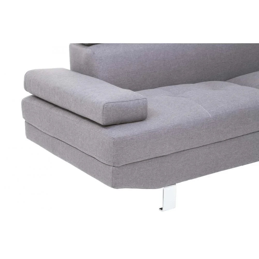 Light grey fabric sofa with chrome leg and wide armrest, close-up of seat corner